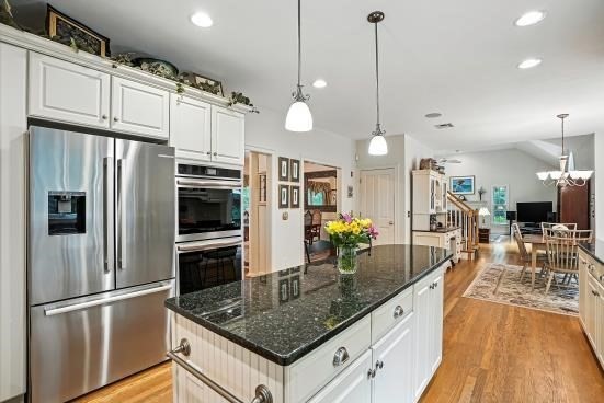 8 Miscoe Hill Road Upton, MA 01568 - Photo 7 of 40 a kitchen with stainless steel appliances granite countertop a sink refrigerator and microwave