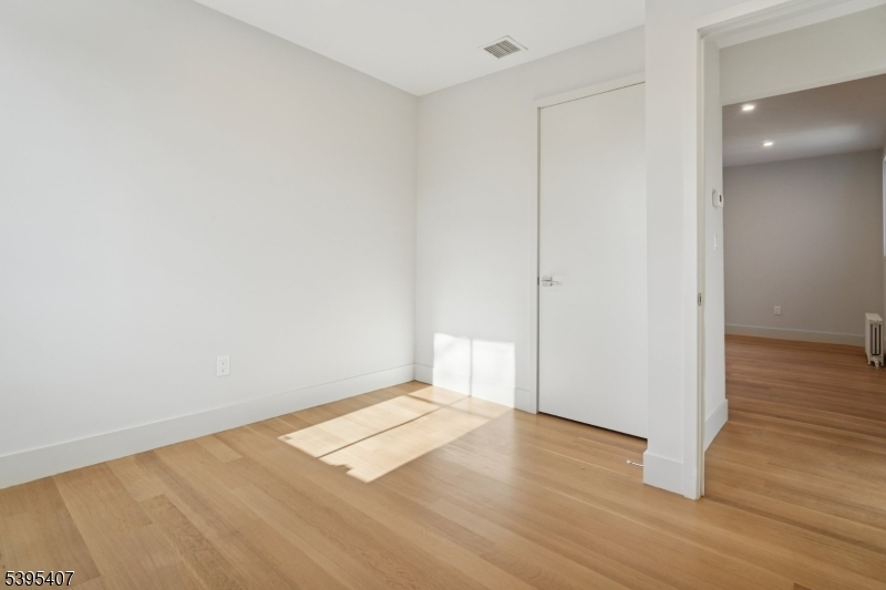 75 Midland Avenue, Unit 2 Montclair, NJ 07042 - Photo 16 of 18 a view of empty room with wooden floor