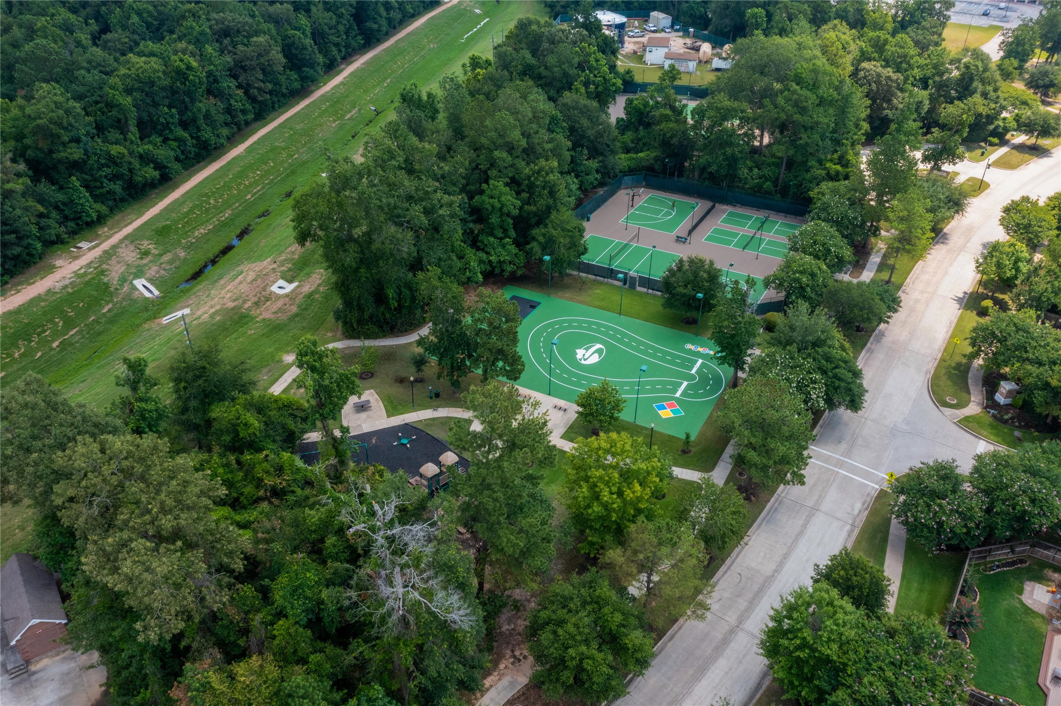 1215 Jake Springs Court Spring, TX 77386 - Photo 43 of 49 Cardinal Sports Park has something for everyone! Tennis courts, pickleball courts, a half court basketball hoop and play space with more games for the kiddos along with another playground.