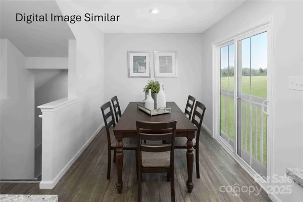 a dining room with furniture a rug a potted plant and a chandelier