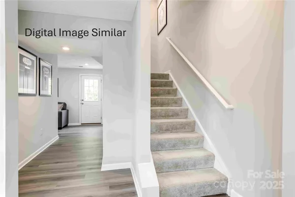 a view of an entryway with wooden floor