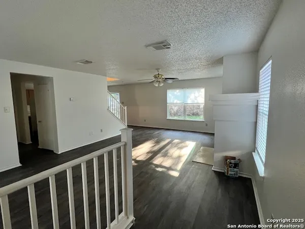 a view of empty room with windows