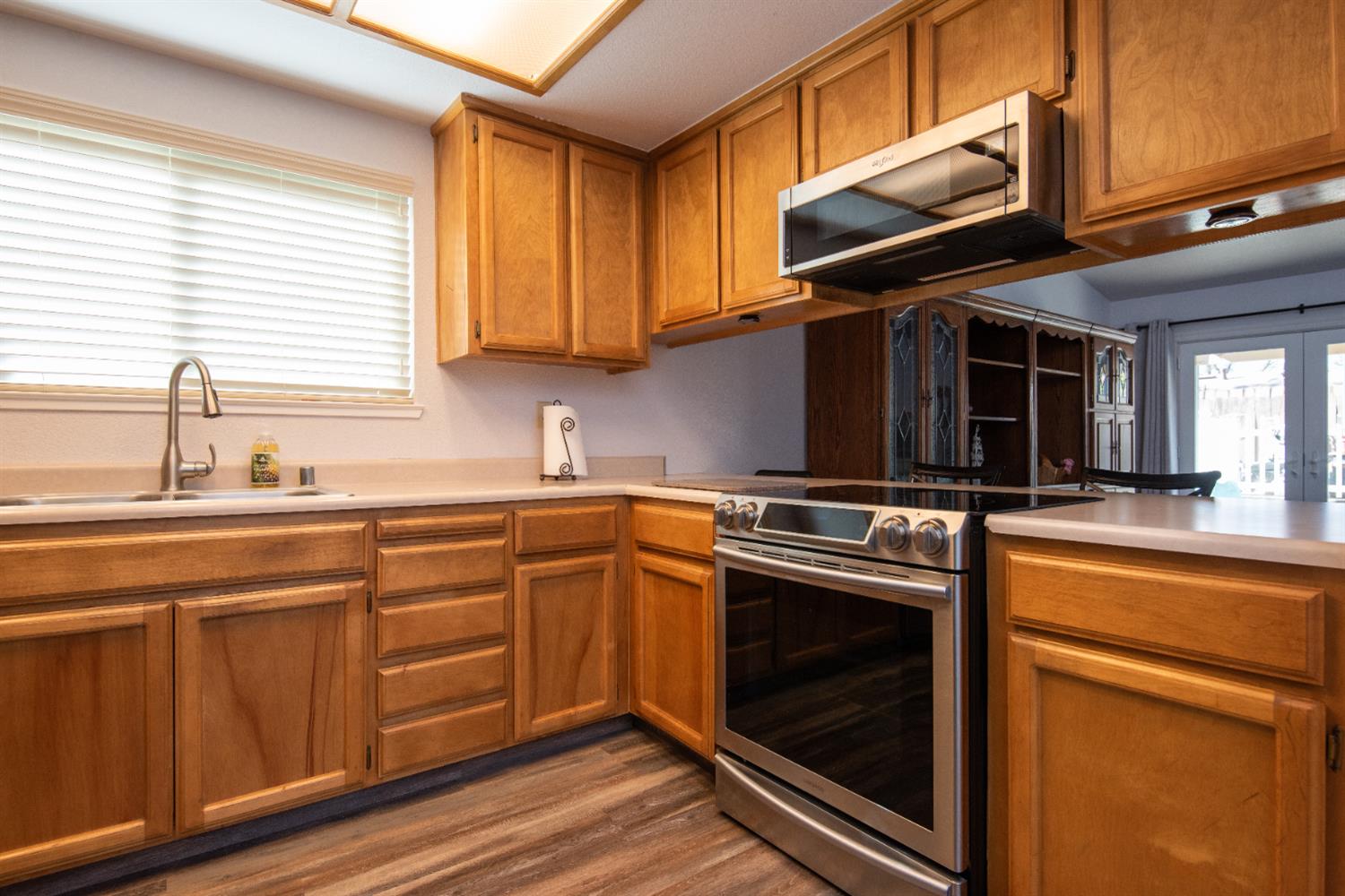 301 Goldrun Drive Modesto, CA 95354 - Photo 6 of 20 a kitchen with stainless steel appliances granite countertop a stove and a sink