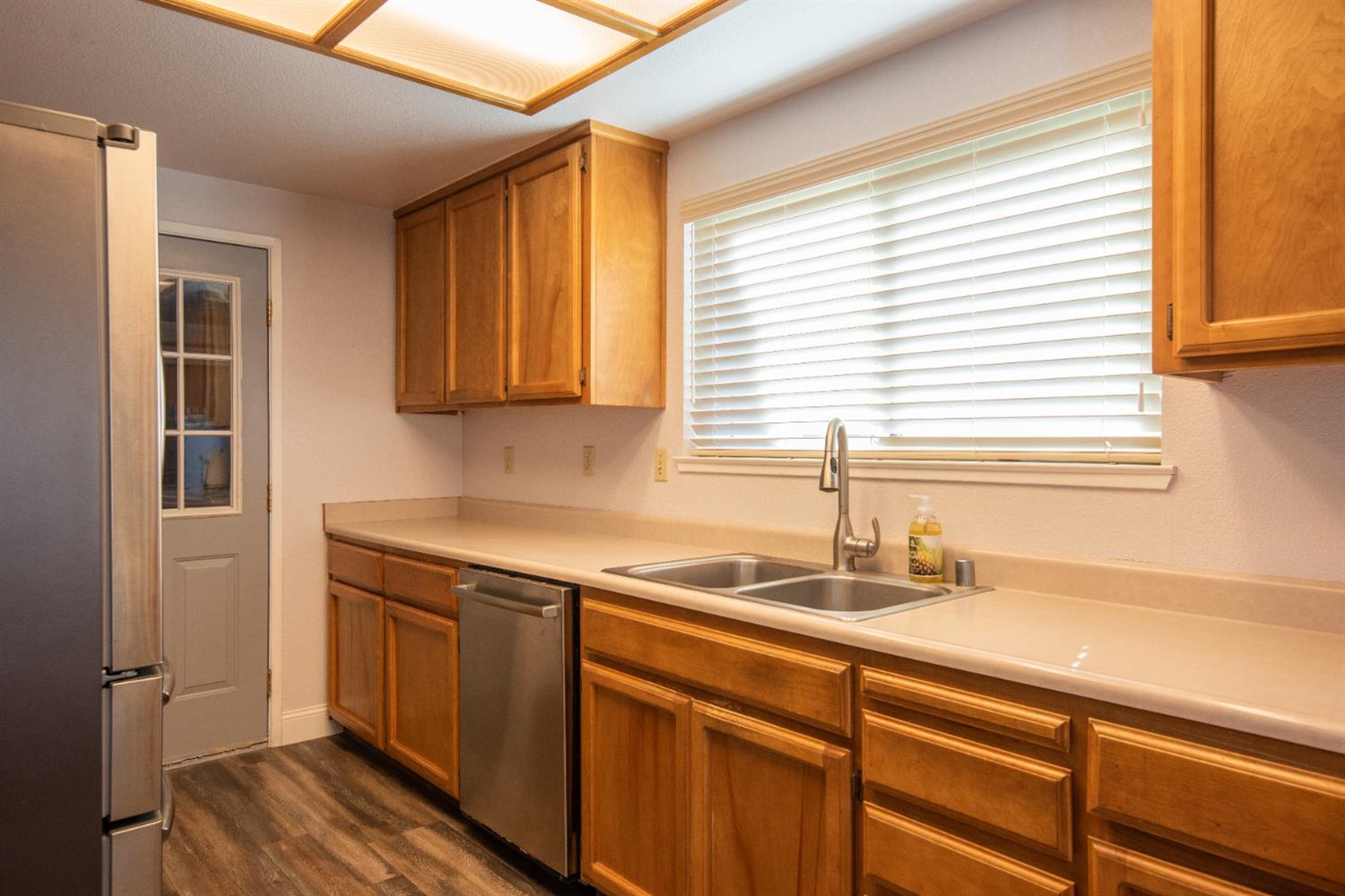 301 Goldrun Drive Modesto, CA 95354 - Photo 8 of 20 a kitchen with a sink and a window