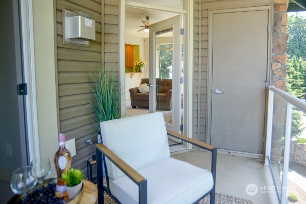 1419 Digby Place, Unit 309 Mount Vernon, WA 98274 - Photo 14 of 34 a balcony view with a sink and glass door