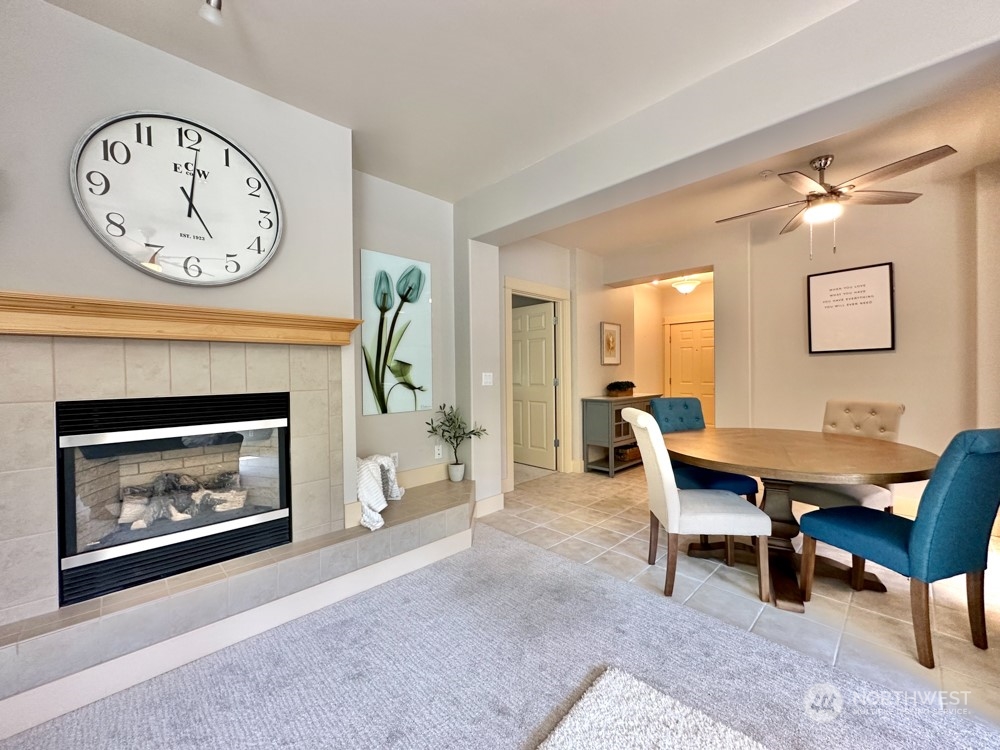 1419 Digby Place, Unit 309 Mount Vernon, WA 98274 - Photo 15 of 34 a view of a livingroom with furniture a fireplace and a clock