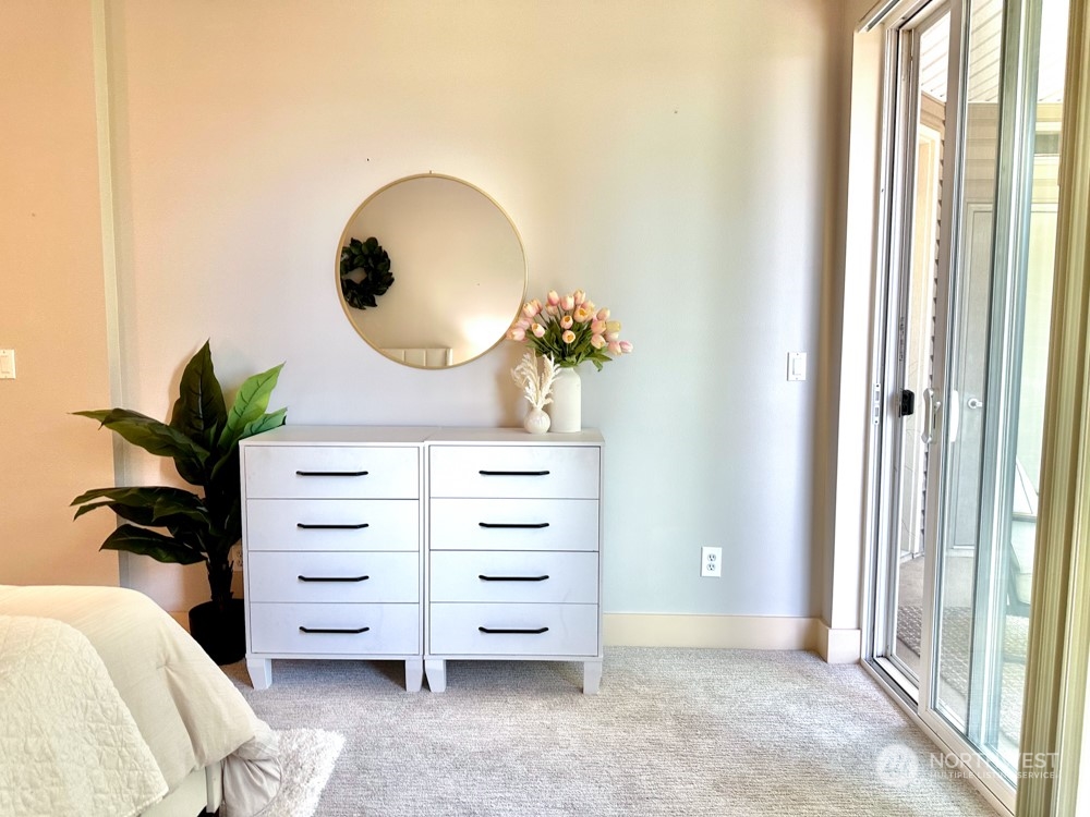 1419 Digby Place, Unit 309 Mount Vernon, WA 98274 - Photo 19 of 34 a view of bedroom with furniture and a potted plant