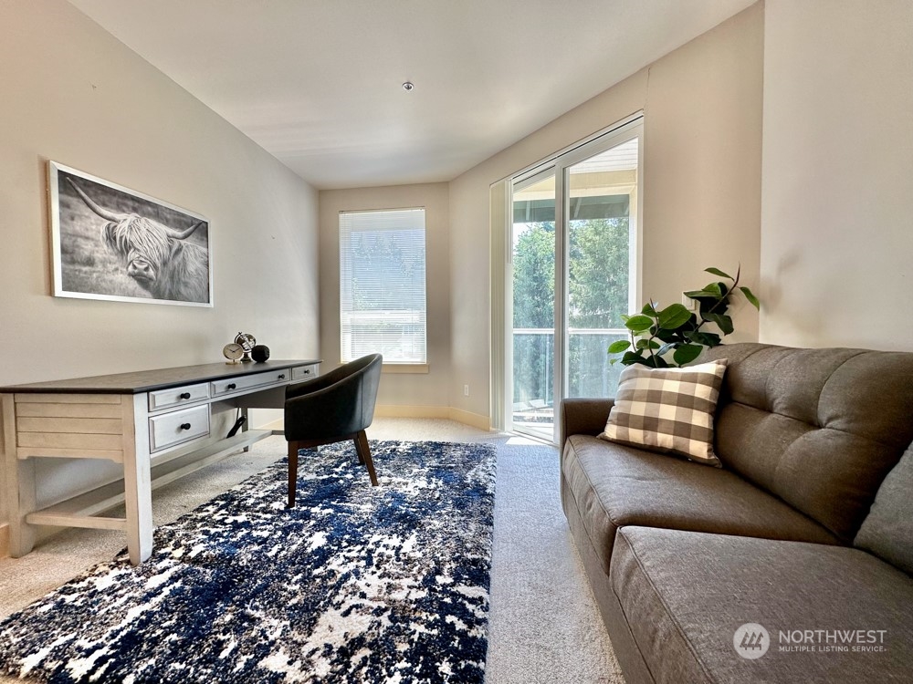 1419 Digby Place, Unit 309 Mount Vernon, WA 98274 - Photo 25 of 34 a living room with furniture lamp and window
