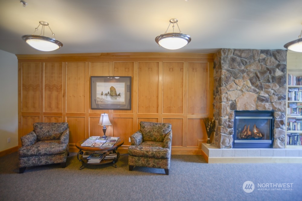 1419 Digby Place, Unit 309 Mount Vernon, WA 98274 - Photo 30 of 34 a living room with furniture and a fireplace