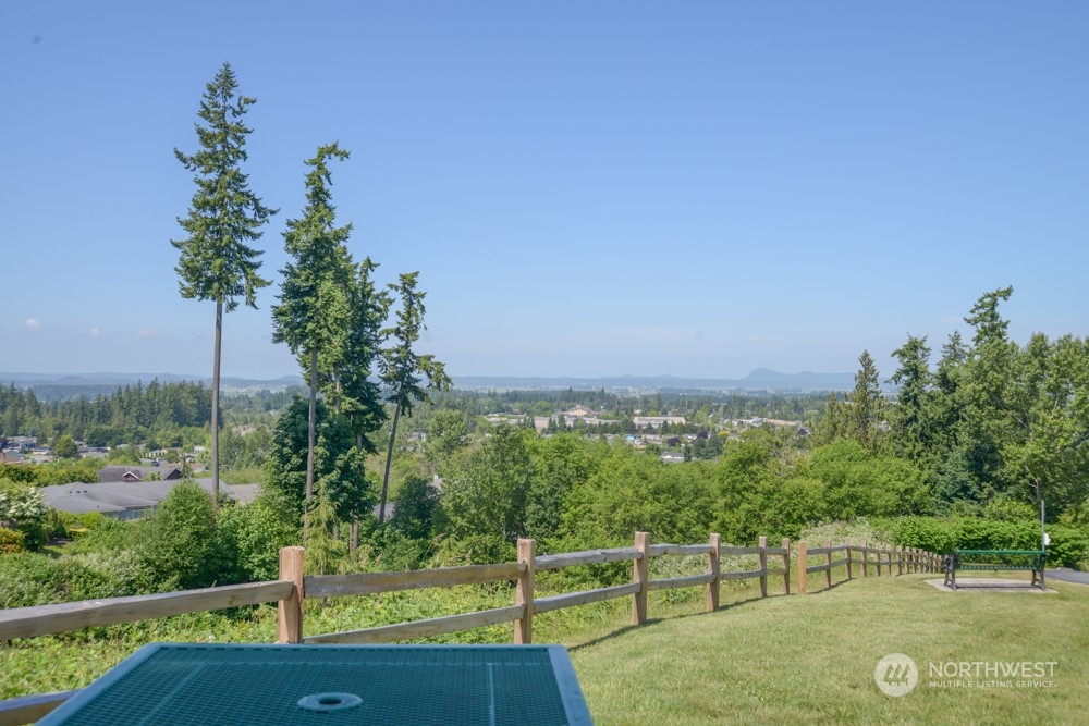 1419 Digby Place, Unit 309 Mount Vernon, WA 98274 - Photo 33 of 34 a view of a green field with sitting area