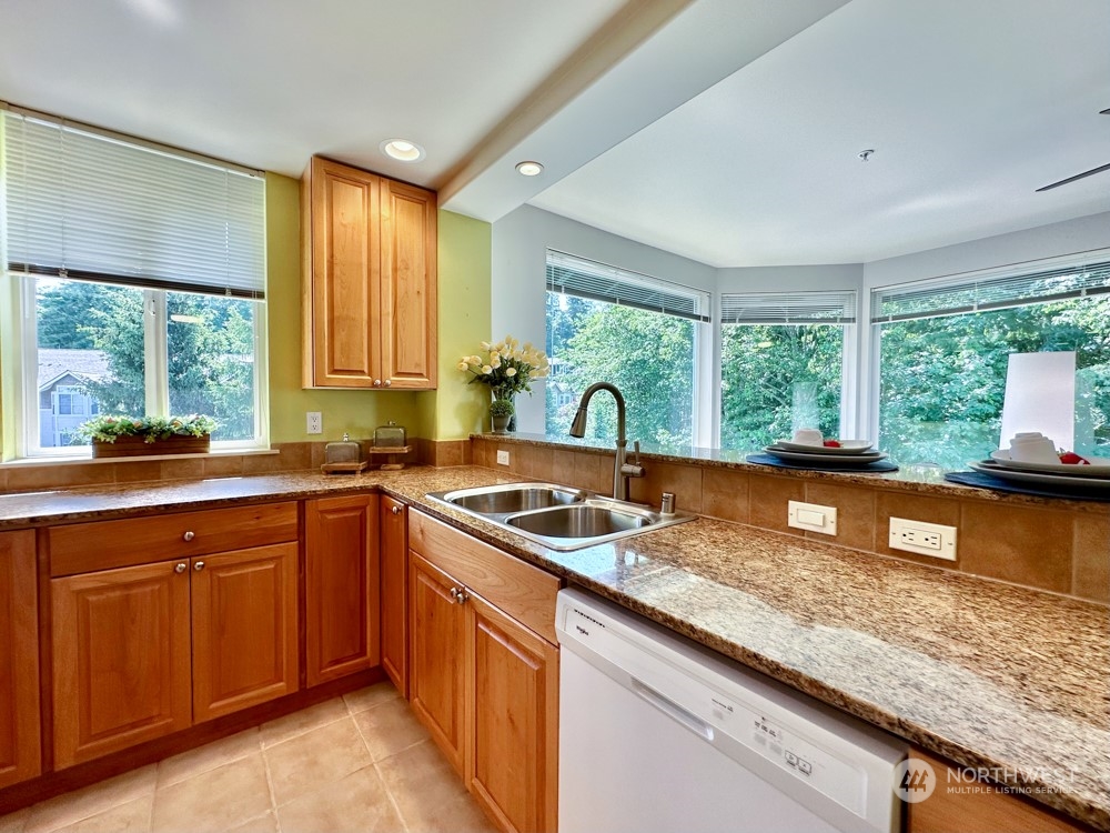 1419 Digby Place, Unit 309 Mount Vernon, WA 98274 - Photo 7 of 34 a kitchen with large windows and sink