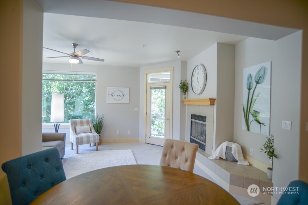 1419 Digby Place, Unit 309 Mount Vernon, WA 98274 - Photo 9 of 34 a living room with fireplace furniture and a window