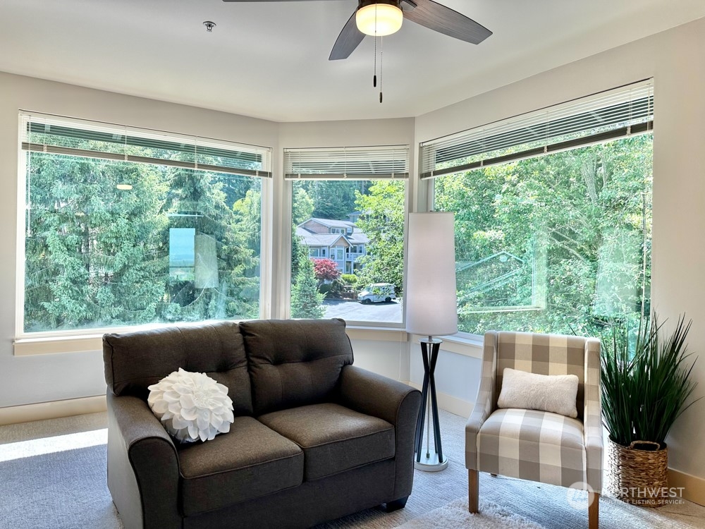 1419 Digby Place, Unit 309 Mount Vernon, WA 98274 - Photo 10 of 34 a living room with furniture and a large window