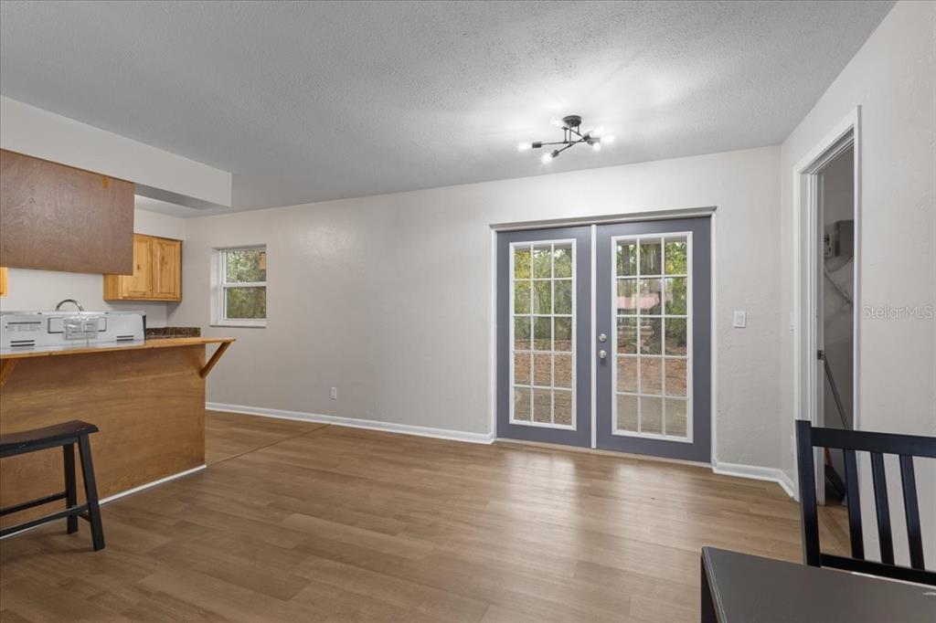 1315 Southwest 252nd Street Newberry, FL 32669 - Photo 12 of 29 a workspace with wooden floor