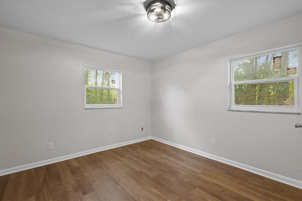 1315 Southwest 252nd Street Newberry, FL 32669 - Photo 19 of 29 an empty room with a window