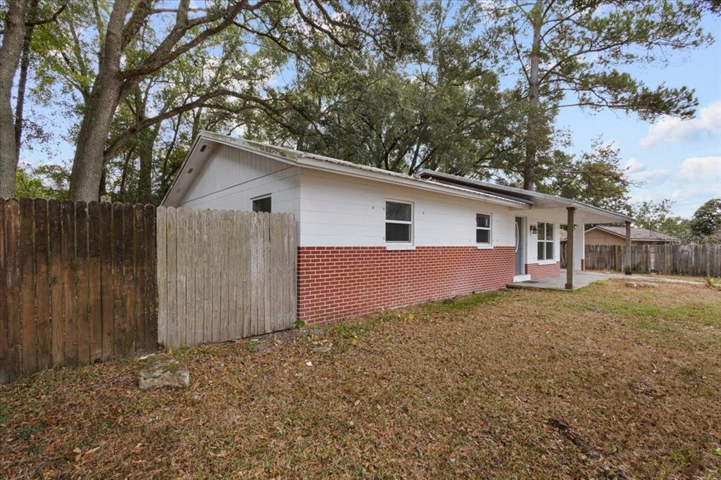1315 Southwest 252nd Street Newberry, FL 32669 - Photo 4 of 29 a view of a house with a yard