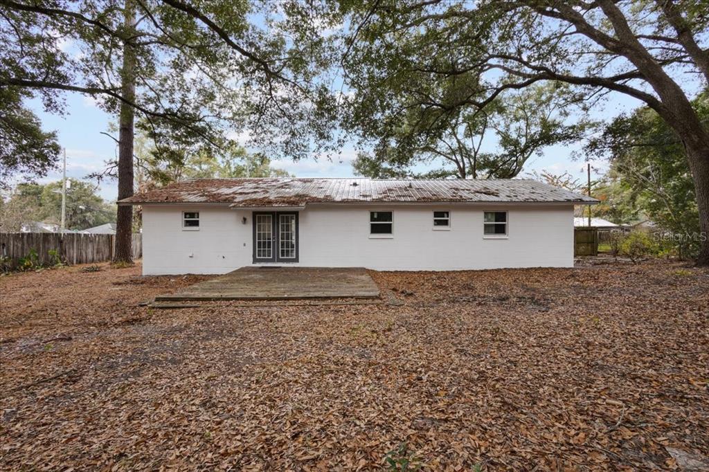 1315 Southwest 252nd Street Newberry, FL 32669 - Photo 5 of 29 a house view with a backyard space