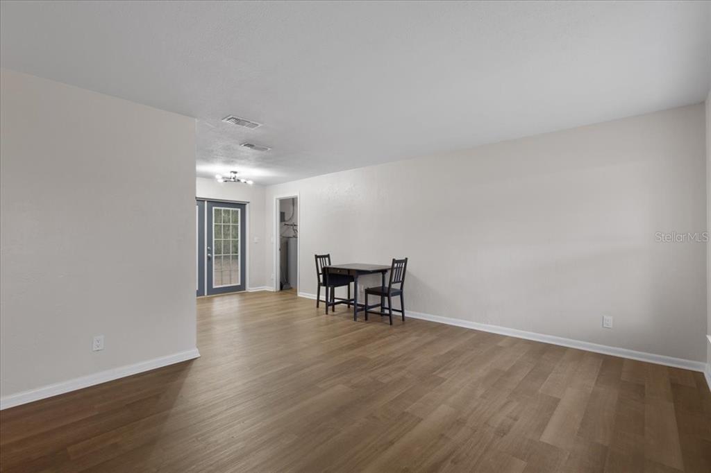 1315 Southwest 252nd Street Newberry, FL 32669 - Photo 6 of 29 a view of work space with wooden floor and a window