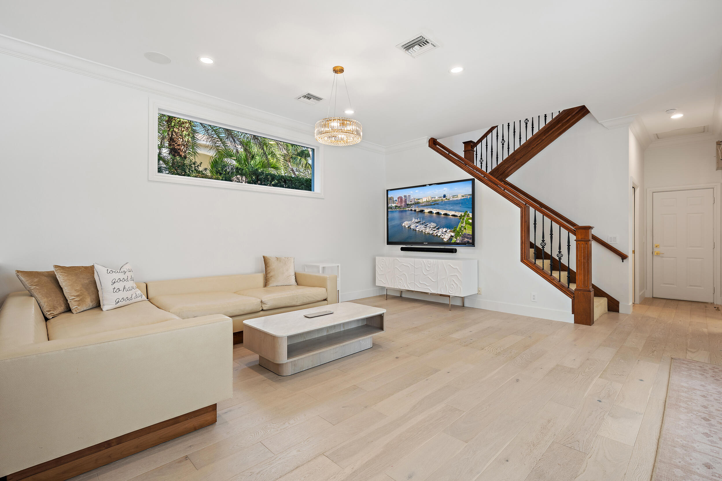 325 Eagle Drive Jupiter, FL 33477 - Photo 14 of 48 a view of a livingroom with furniture and stairs