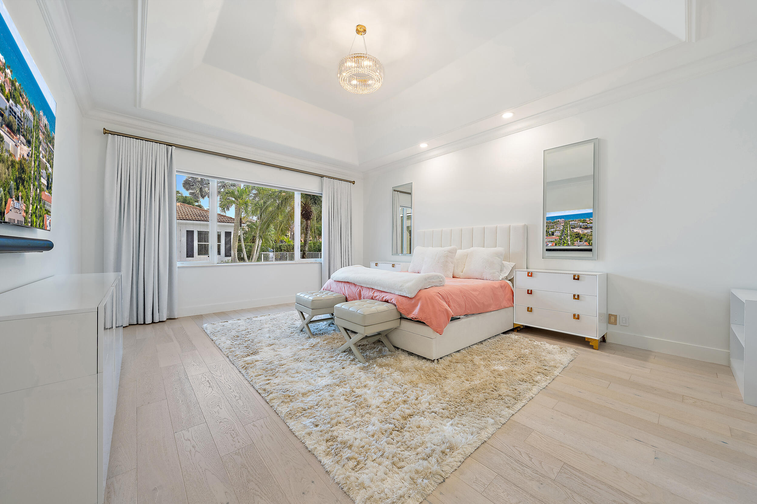 325 Eagle Drive Jupiter, FL 33477 - Photo 16 of 48 a spacious bedroom with a bed and a window