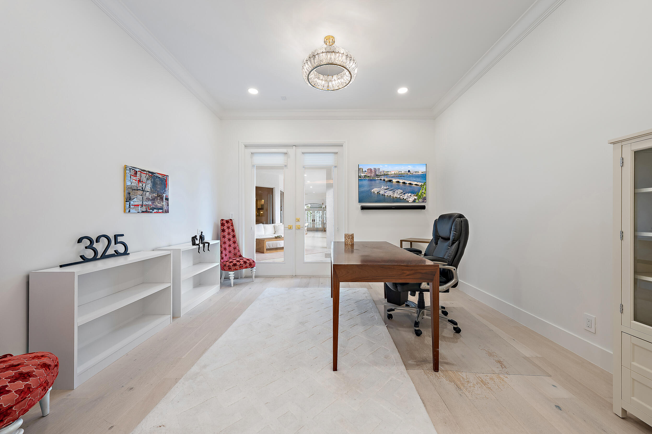 325 Eagle Drive Jupiter, FL 33477 - Photo 17 of 48 a view of a workspace with furniture and a window