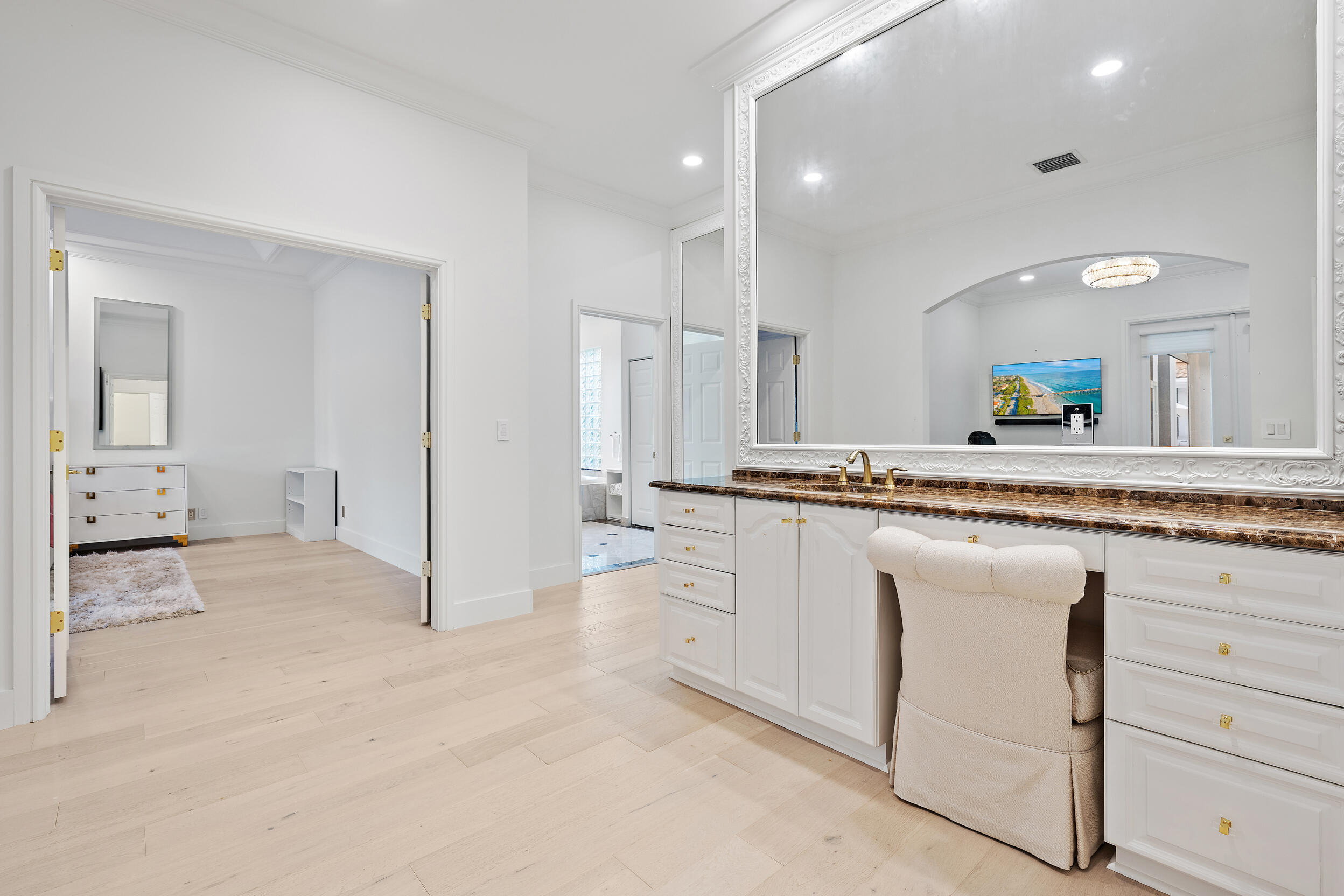 325 Eagle Drive Jupiter, FL 33477 - Photo 21 of 48 a bathroom with a granite countertop sink mirror and white