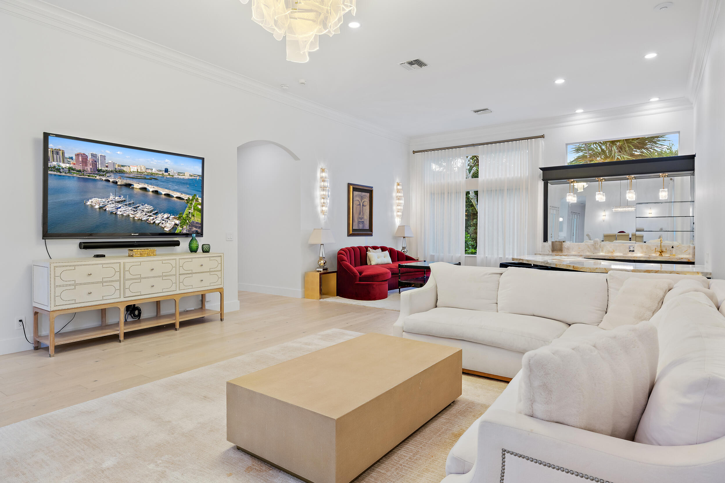 325 Eagle Drive Jupiter, FL 33477 - Photo 7 of 48 a living room with furniture gym equipment and a flat screen tv
