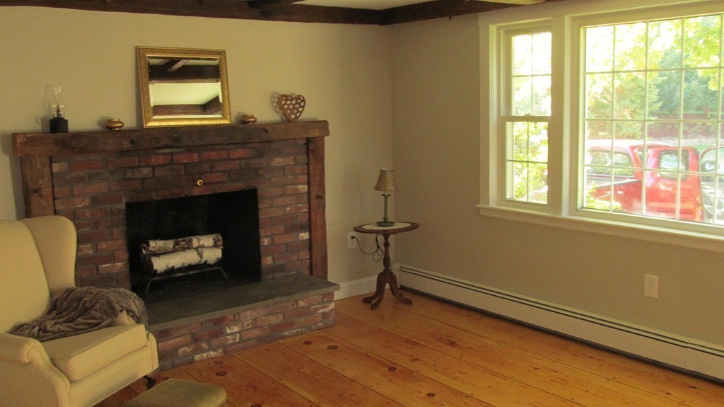 23 Magnolia Road Natick, MA 01760 - Photo 3 of 13 a living room with furniture and a fireplace