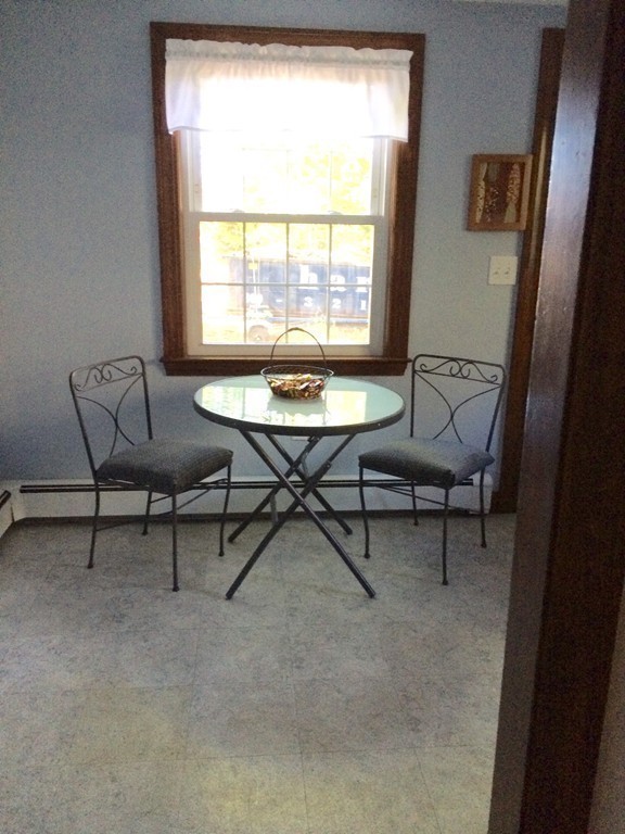 23 Magnolia Road Natick, MA 01760 - Photo 7 of 13 a view of a workspace with furniture and a window