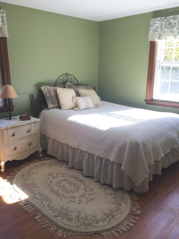 23 Magnolia Road Natick, MA 01760 - Photo 8 of 13 a bedroom with a bed and a window