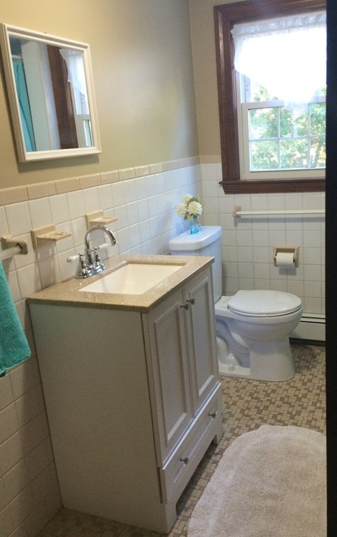 23 Magnolia Road Natick, MA 01760 - Photo 9 of 13 a bathroom with a sink toilet and window