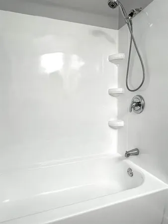 a bathroom with a shower and a bathtub