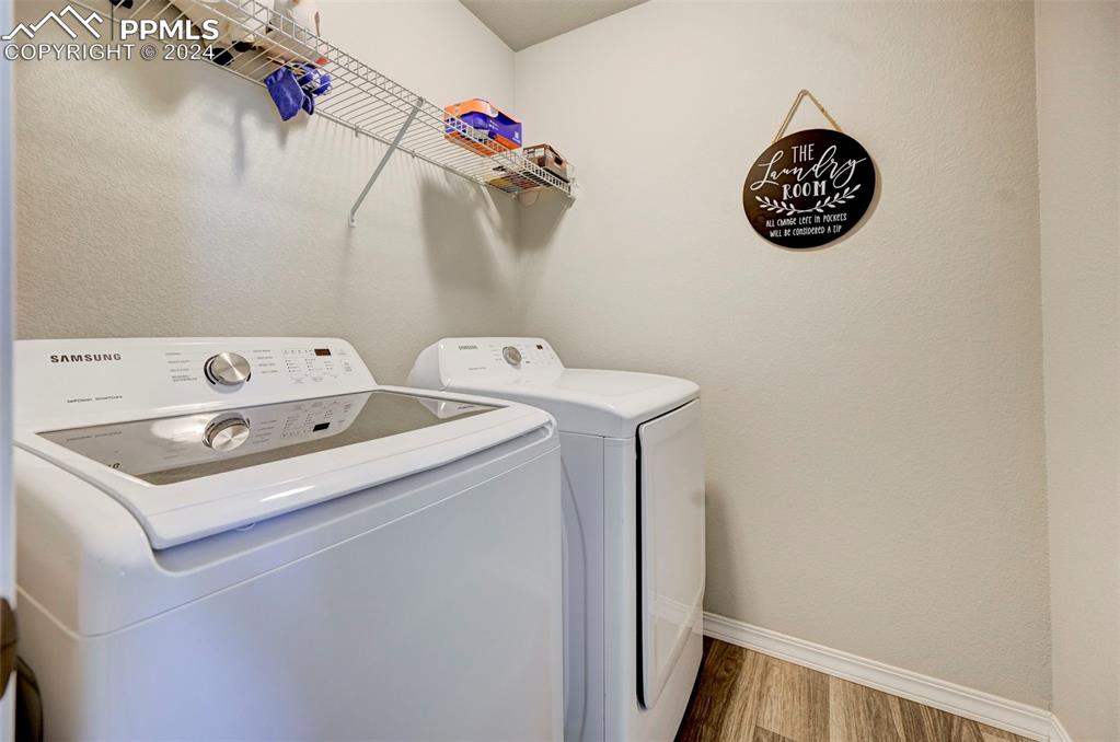 4472 Gneiss Loop Colorado Springs, CO 80938 - Photo 27 of 30 a utility room with dryer and washer