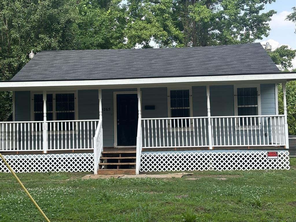 a side view of a house with a deck