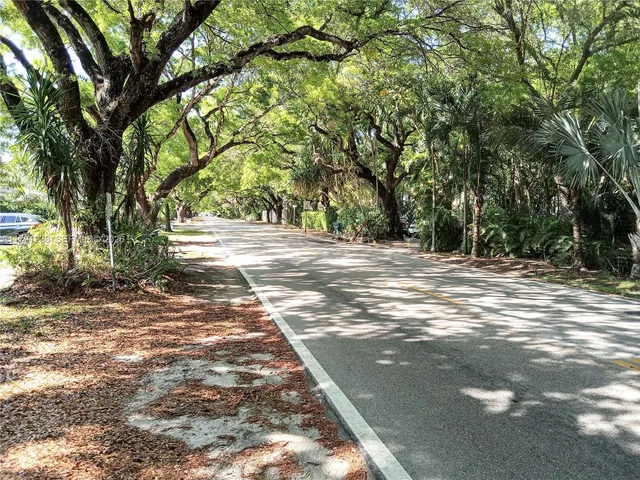 a view of a house with a tree in the background