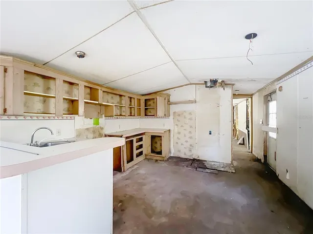 a view of a swimming pool with a yard