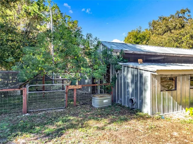 a view of swimming space with trees