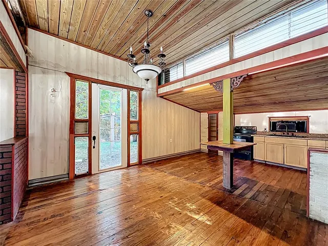a view of a livingroom with furniture and hardwood floor
