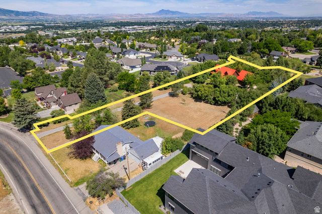435 Canyon Road Millville, UT 84326 - Photo 110 of 113 Expansive property featuring a substantial land parcel, established perimeter fencing, mature trees, and a mountain range backdrop