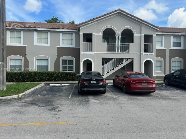 a view of a car parked in front of a house