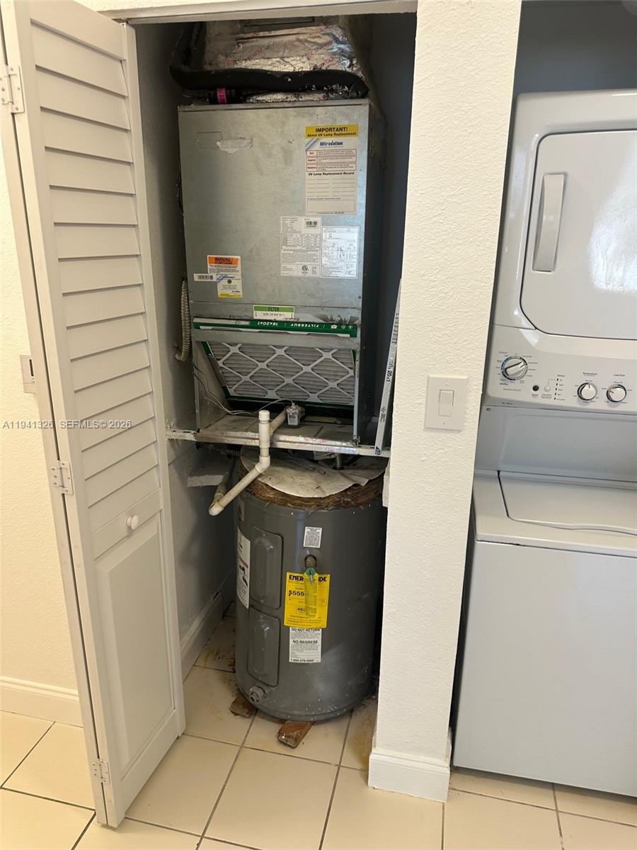 1663 Southeast 27th Drive, Unit 102 Homestead, FL 33035 - Photo 12 of 18 a view of washer and dryer