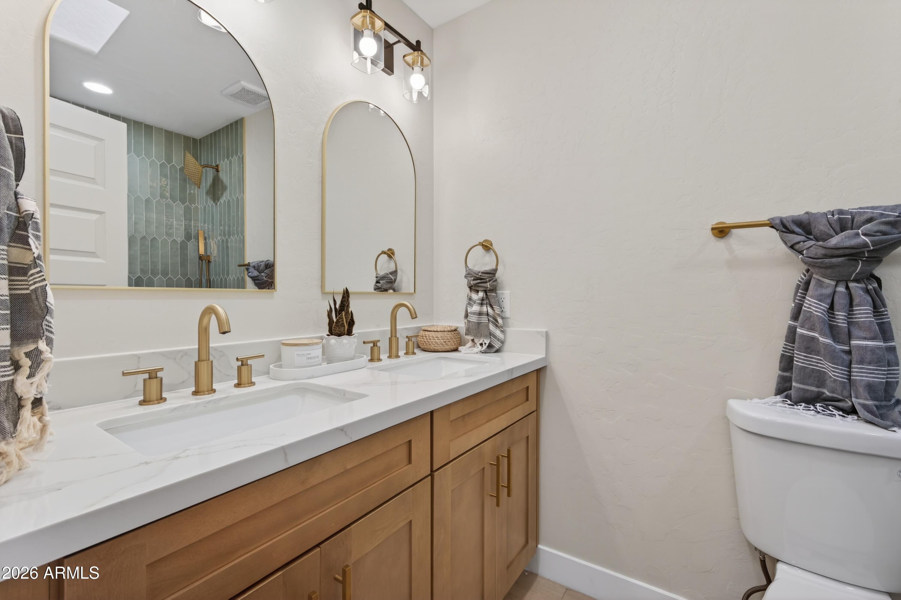 4814 East Monte Way Phoenix, AZ 85044 - Photo 17 of 42 a bathroom with a sink and a mirror