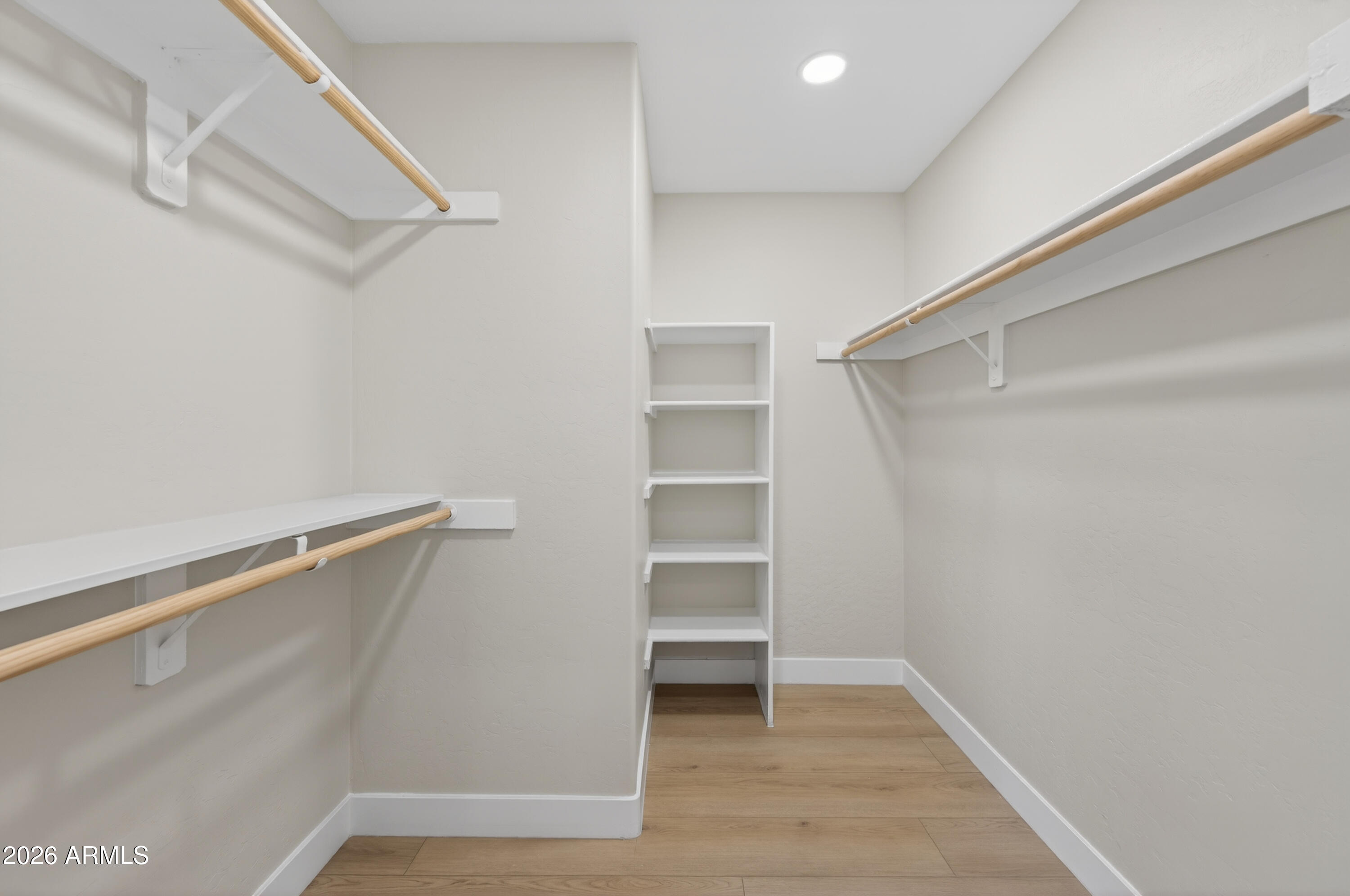 4814 East Monte Way Phoenix, AZ 85044 - Photo 19 of 42 a view of walk in closet with empty racks