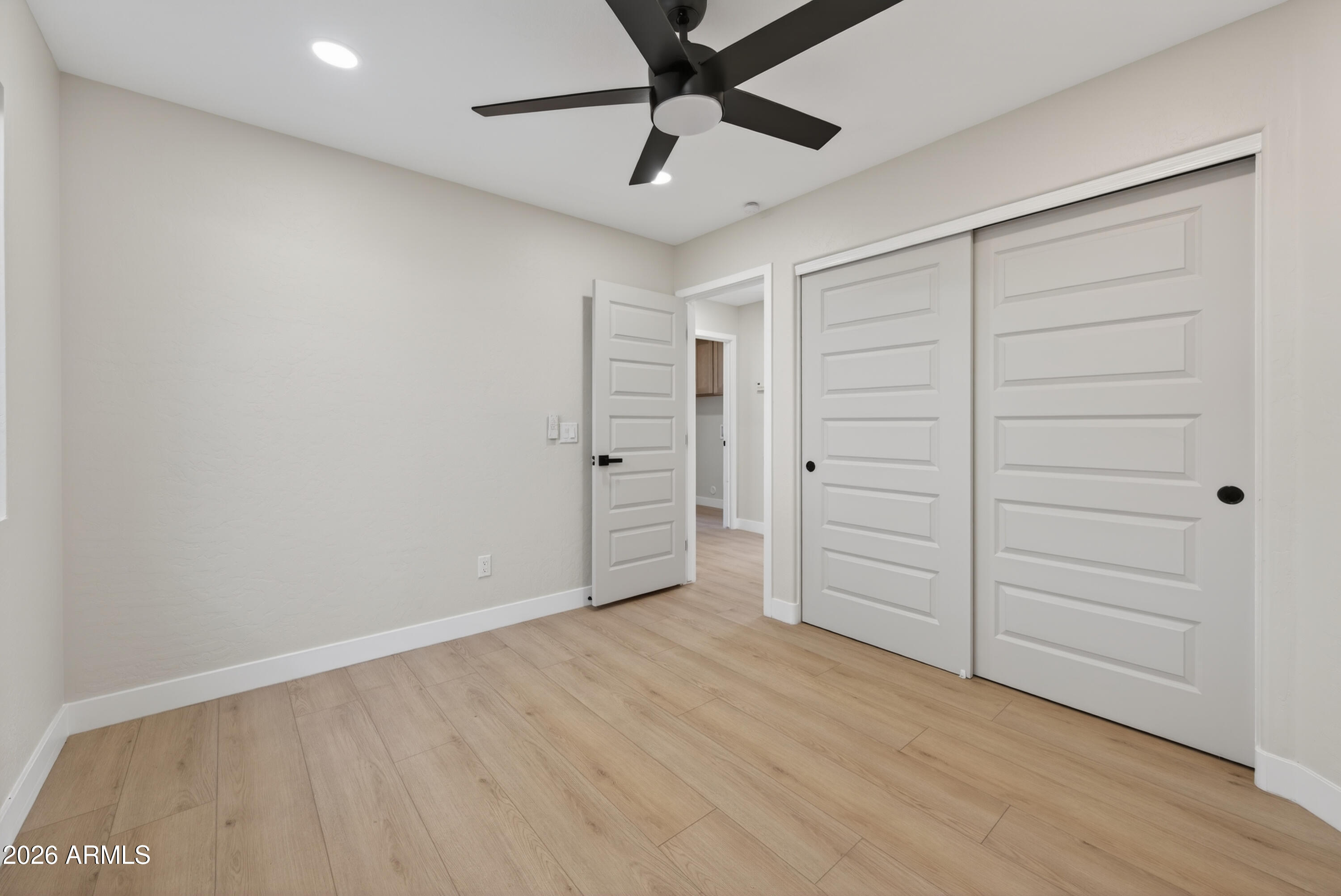 4814 East Monte Way Phoenix, AZ 85044 - Photo 21 of 42 wooden floor in an empty room