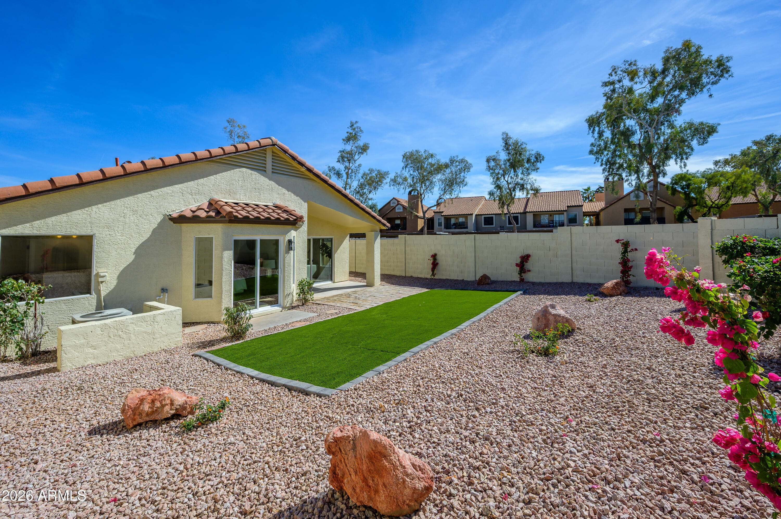 4814 East Monte Way Phoenix, AZ 85044 - Photo 27 of 42 a front view of a house with a yard