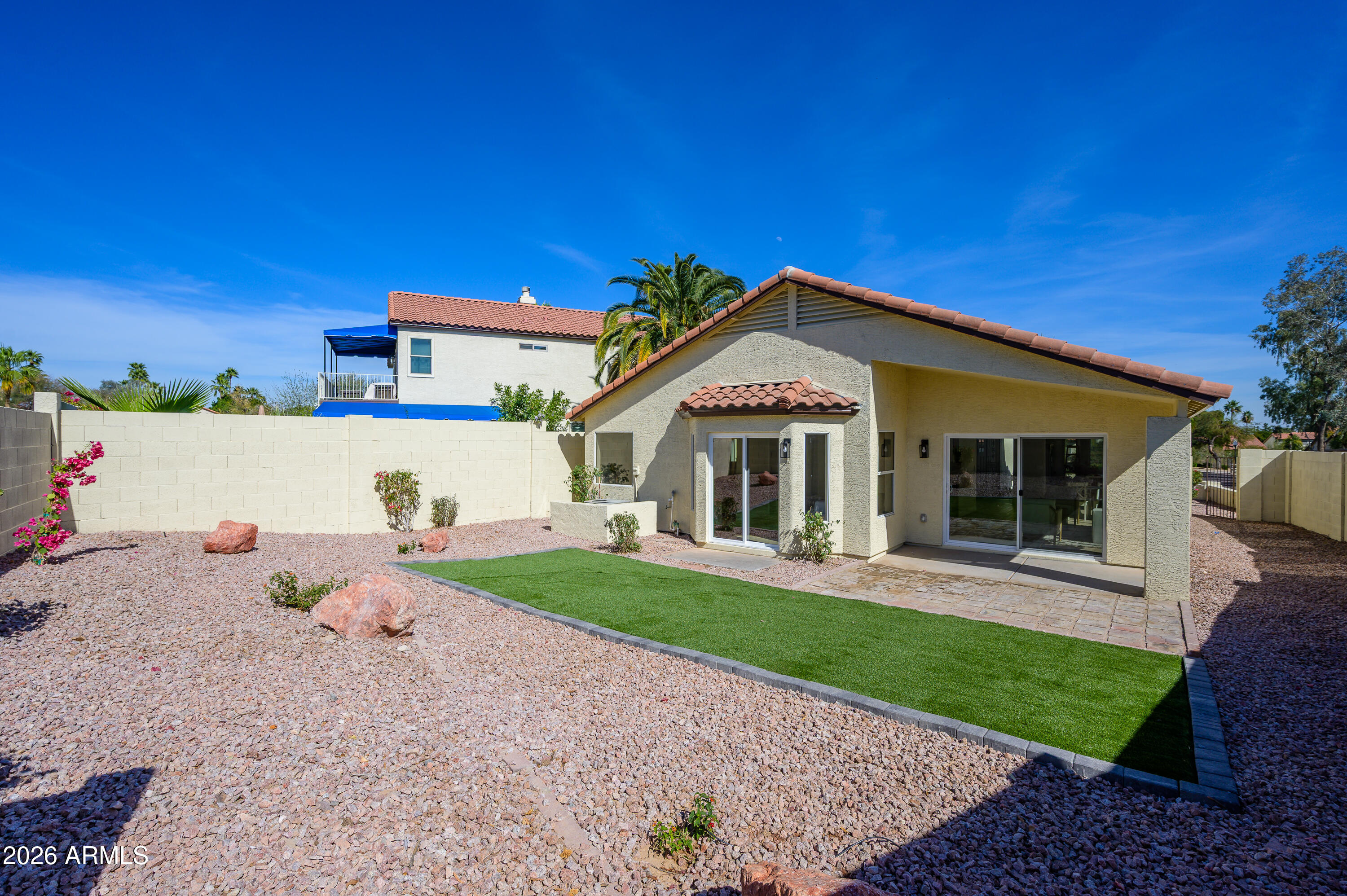 4814 East Monte Way Phoenix, AZ 85044 - Photo 28 of 42 a front view of a house with a yard