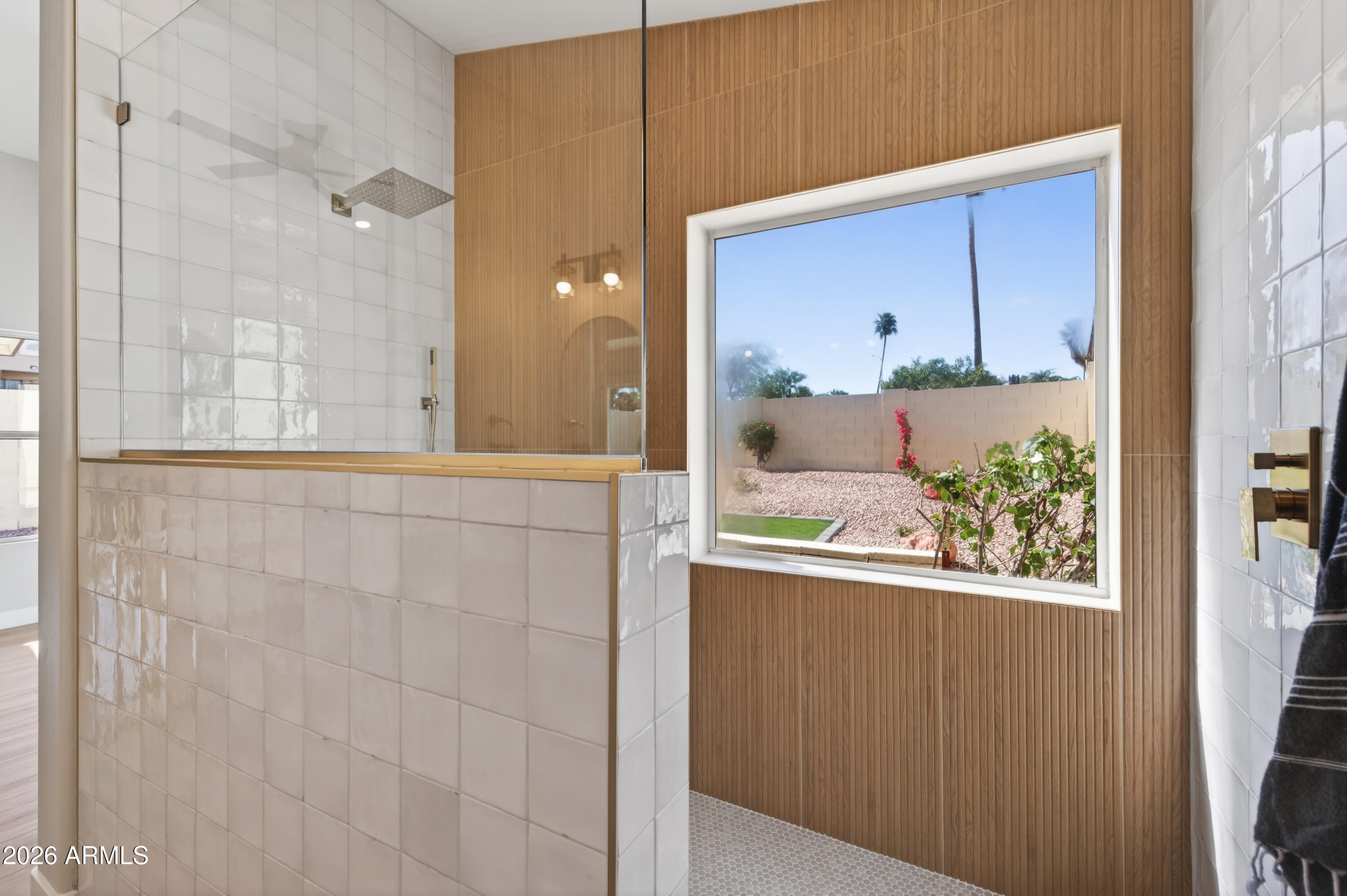 4814 East Monte Way Phoenix, AZ 85044 - Photo 2 of 42 a view of a bathroom with a glass door shower and sink