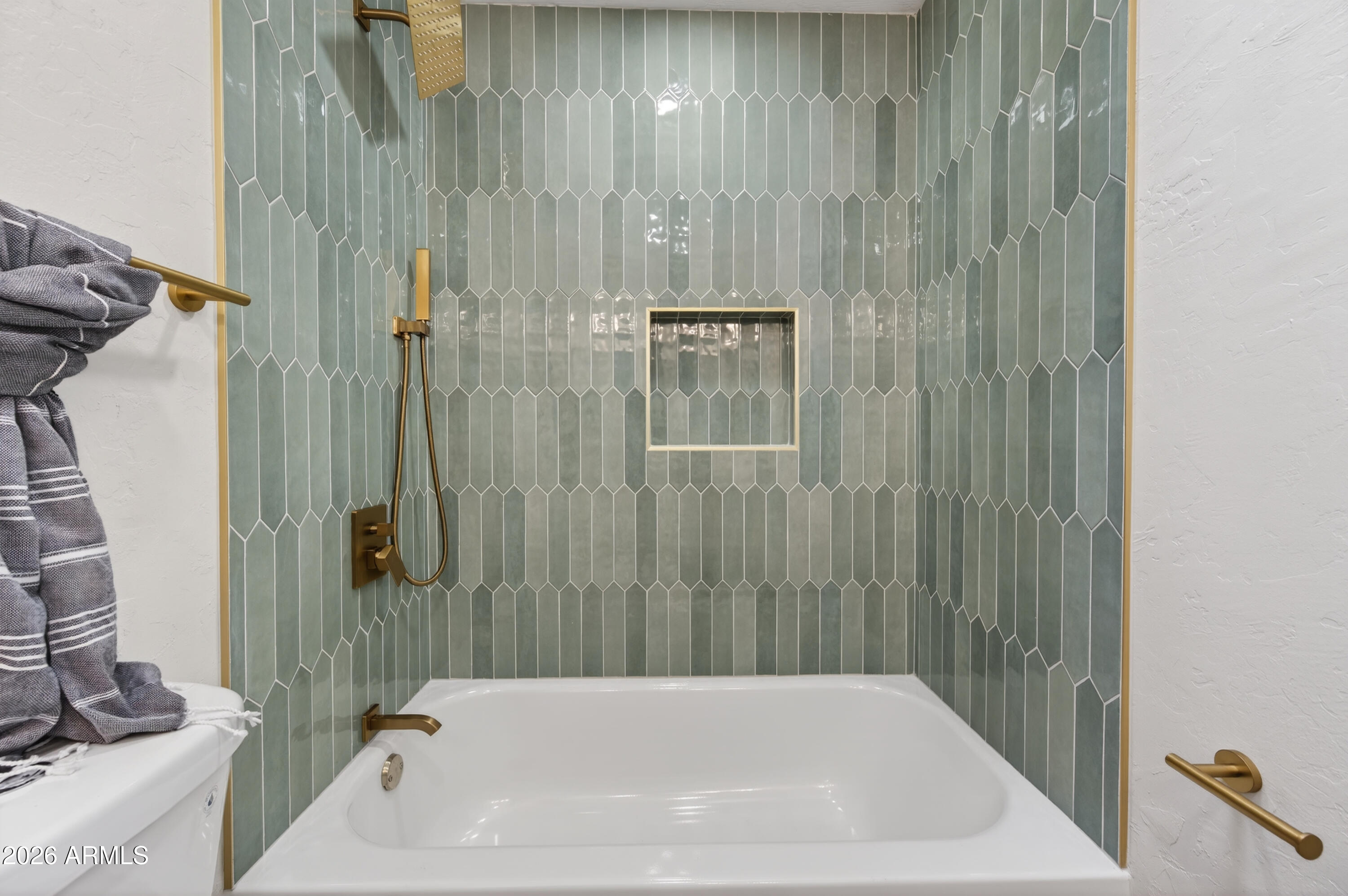 4814 East Monte Way Phoenix, AZ 85044 - Photo 3 of 42 a bathroom with a bathtub and a shower
