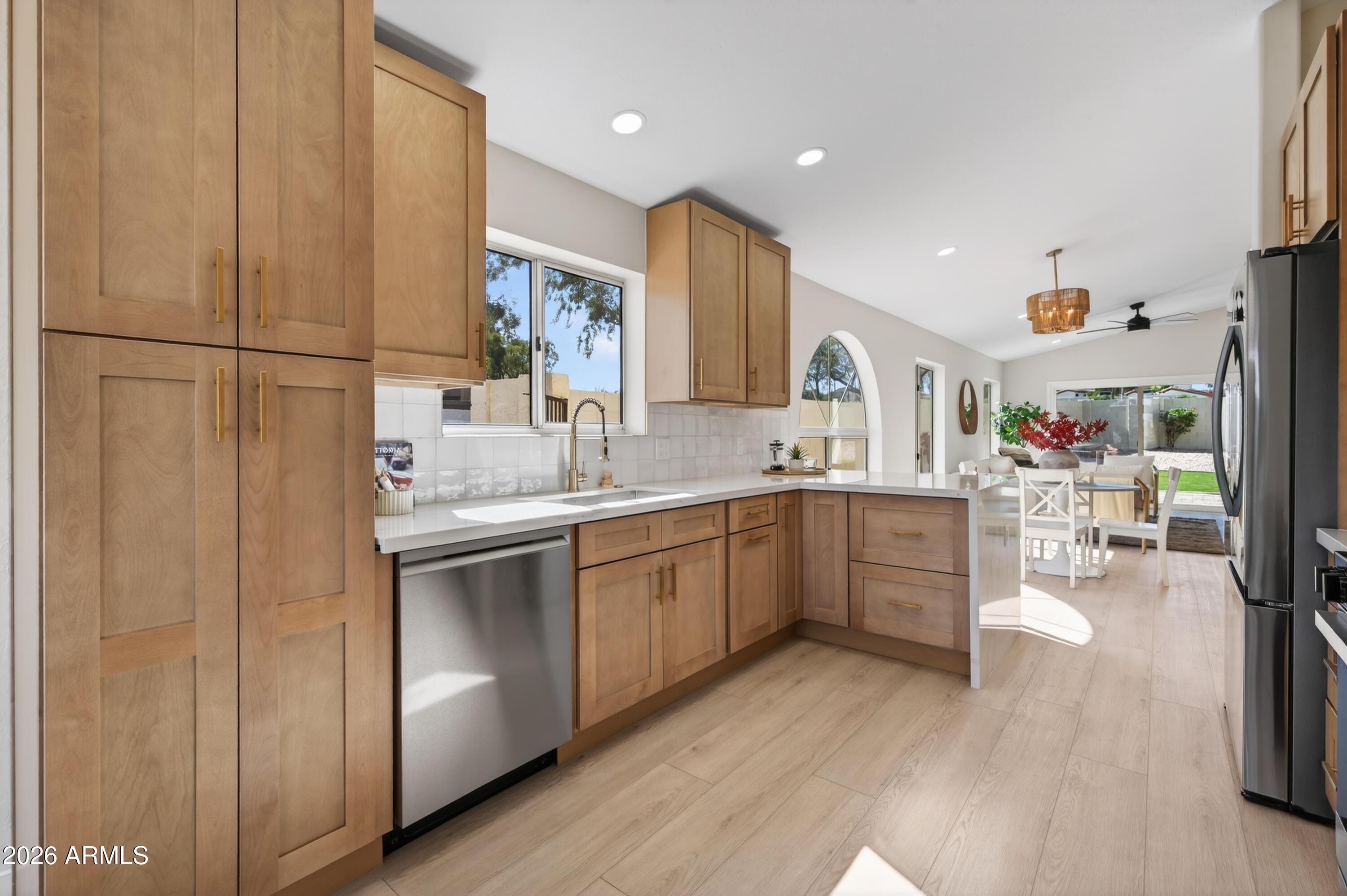 4814 East Monte Way Phoenix, AZ 85044 - Photo 6 of 42 a kitchen with a sink cabinets and wooden floor