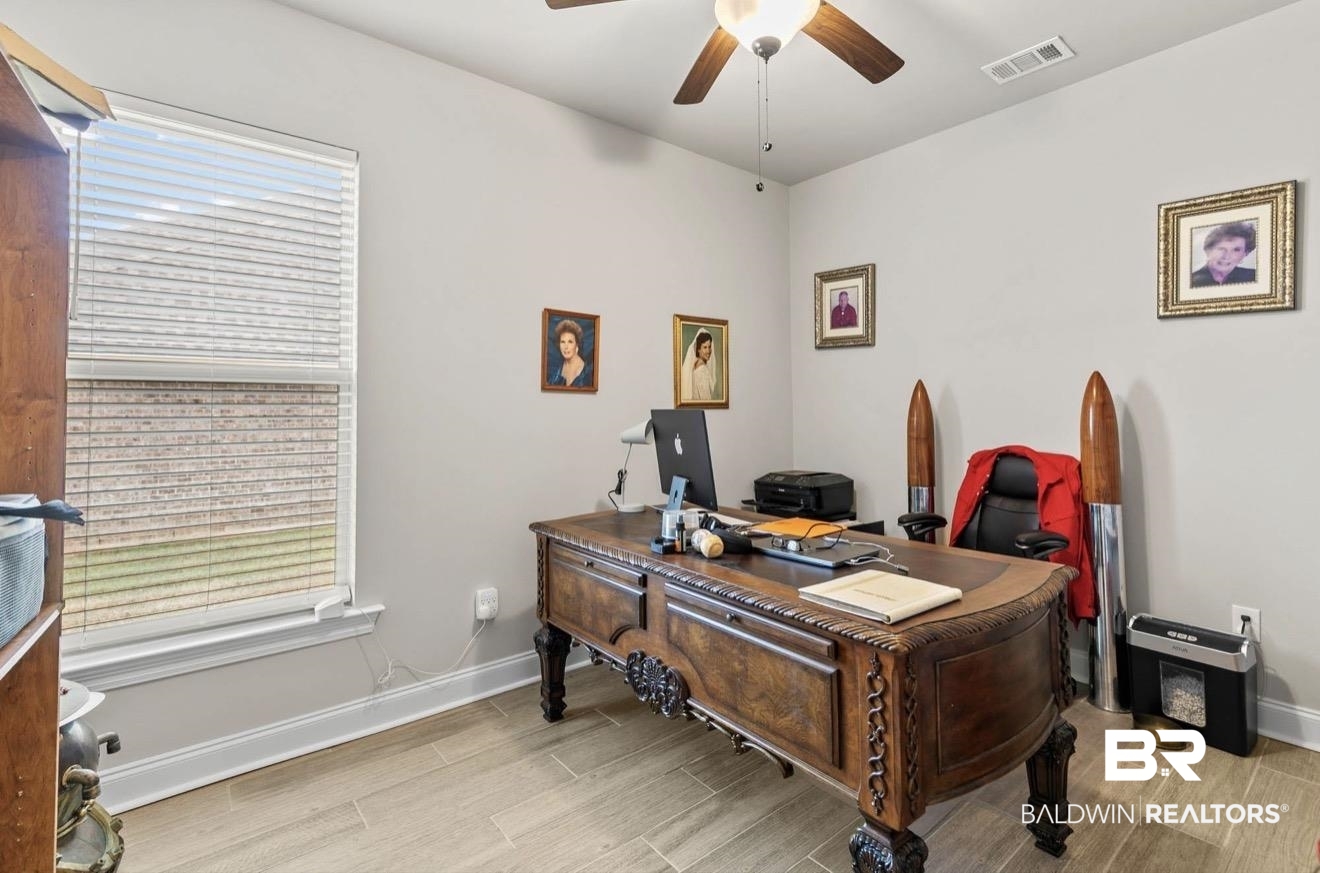 10126 Chipper Lane Foley, AL 36535 - Photo 23 of 30 Office area featuring wood finish floors and a ceiling fan